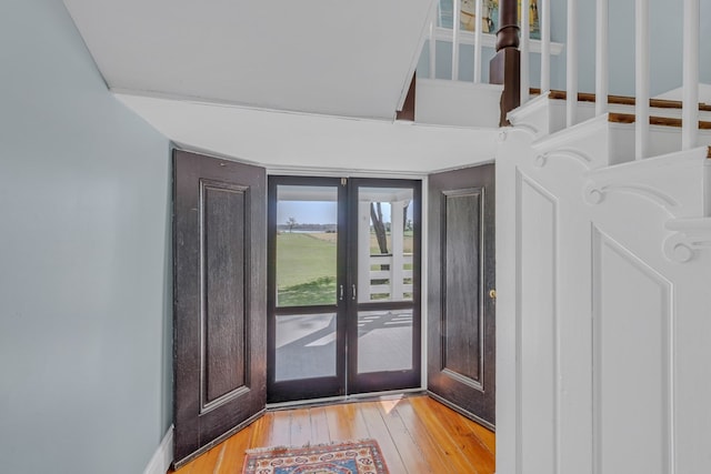 foyer entrance with light wood-type flooring