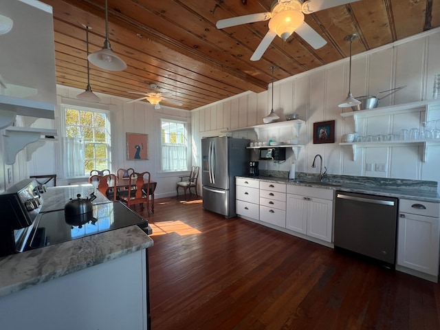 kitchen featuring pendant lighting, wood ceiling, appliances with stainless steel finishes, and white cabinets