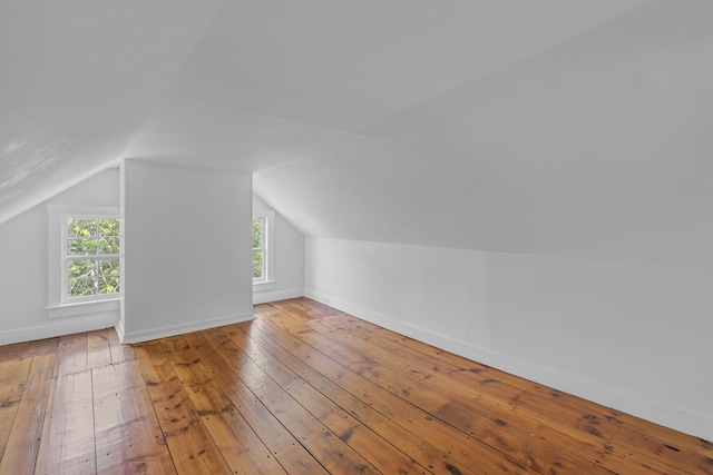 bonus room featuring hardwood / wood-style flooring and vaulted ceiling