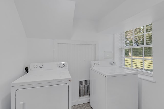 laundry room with washing machine and dryer