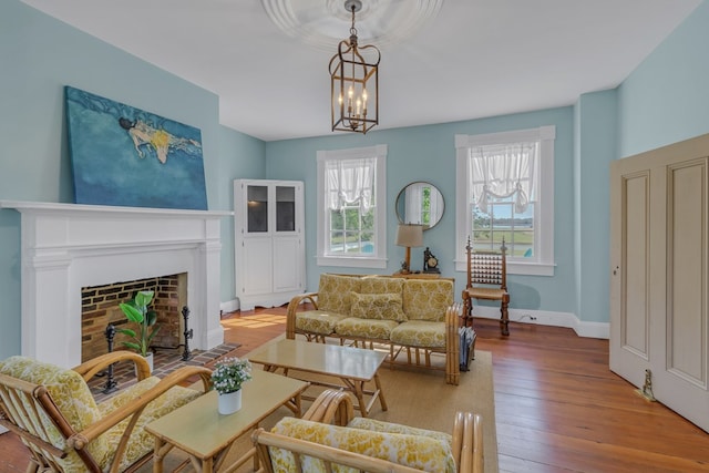 living room with wood-type flooring and an inviting chandelier