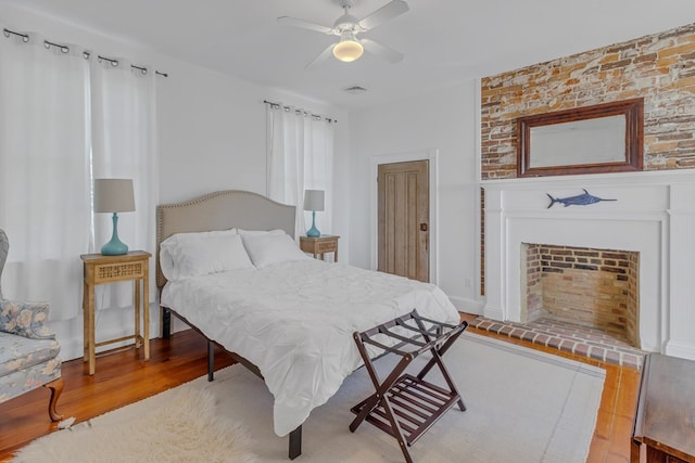 bedroom with ceiling fan and light hardwood / wood-style flooring