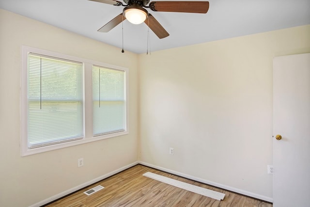 unfurnished room with light wood-type flooring and ceiling fan