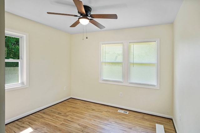 empty room with light wood-type flooring and ceiling fan