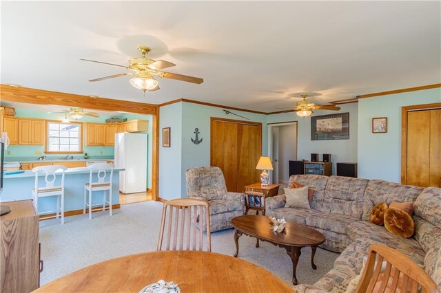 430 Pine Tree Rd, Center Cross, VA 22437 - living area with a ceiling fan, light carpet, and crown molding