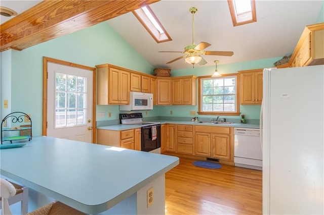 430 Pine Tree Rd, Center Cross, VA 22437 - kitchen with white appliances, a skylight, vaulted ceiling, light countertops, and light wood-style floors