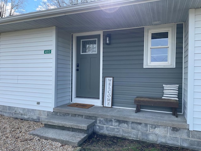 entrance to property featuring covered porch