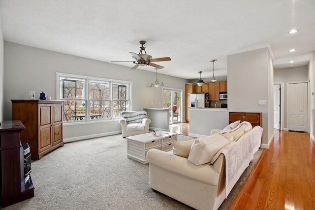 living room with recessed lighting, baseboards, and a ceiling fan