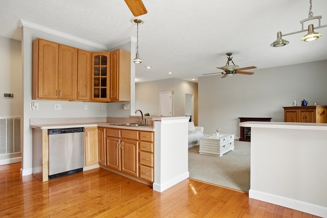 kitchen with a ceiling fan, visible vents, a peninsula, a sink, and dishwasher