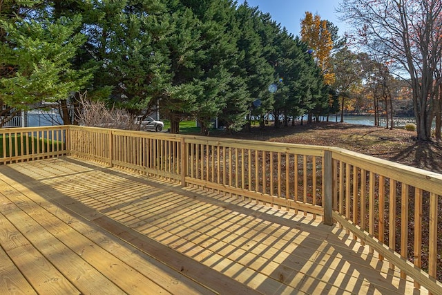 wooden deck with a water view