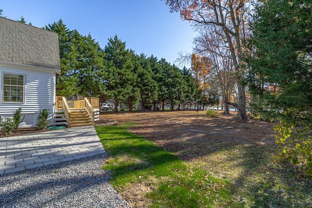 view of yard with a wooden deck