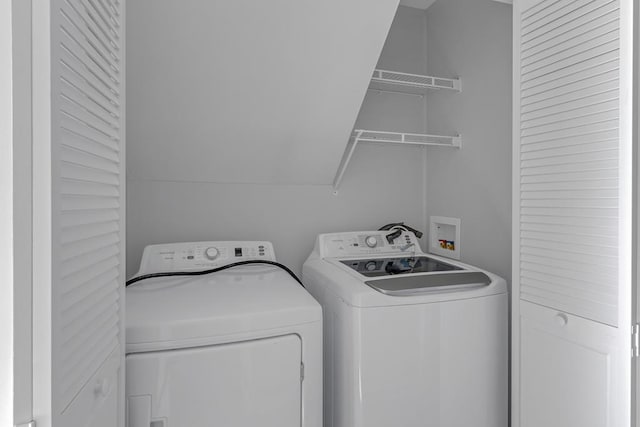 laundry area featuring washing machine and clothes dryer