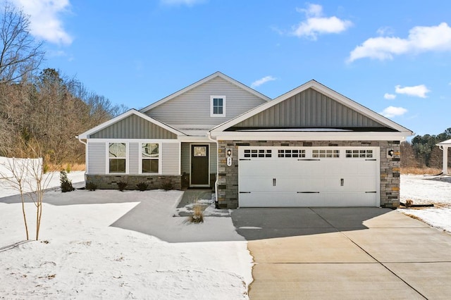 view of front of property with stone siding, board and batten siding, concrete driveway, and an attached garage