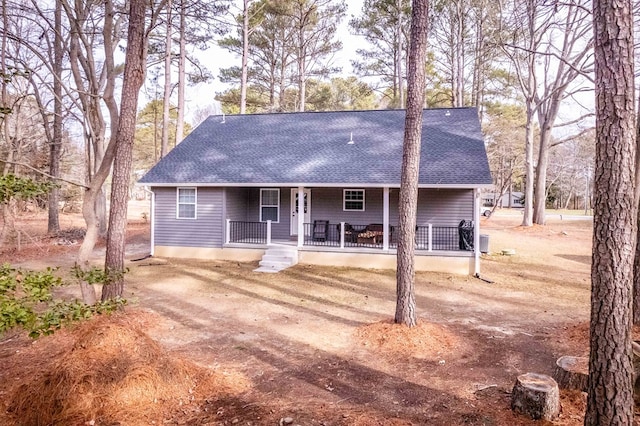 view of front of house with a porch and a shingled roof