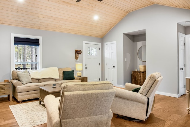 living room featuring lofted ceiling, wooden ceiling, a ceiling fan, baseboards, and light wood-style floors