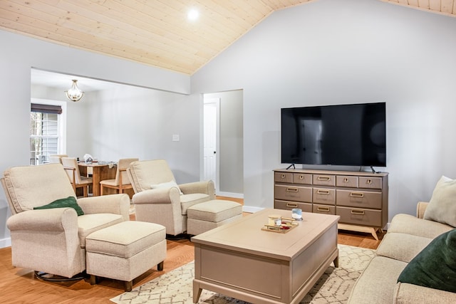 living area with wooden ceiling, light wood finished floors, baseboards, and high vaulted ceiling