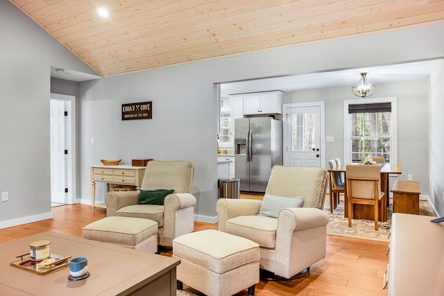 146 Portal Dr, Montross, VA 22520 - living room with light wood finished floors, lofted ceiling, baseboards, and wood ceiling