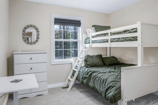 bedroom with carpet floors and baseboards