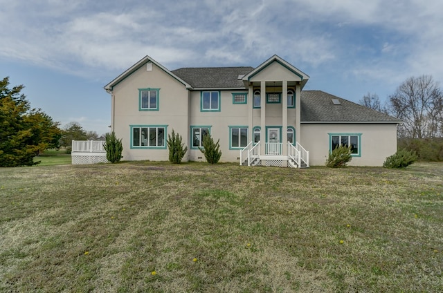 284 Palmer Dr, Lottsburg, VA 22511 - back of property featuring stucco siding, roof with shingles, and a yard
