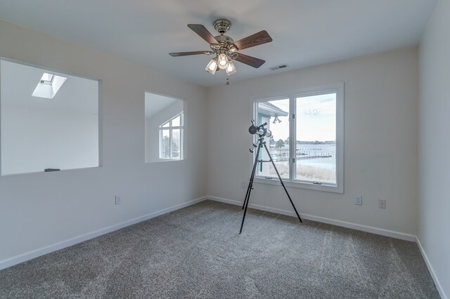284 Palmer Dr, Lottsburg, VA 22511 - interior space with carpet flooring, baseboards, a skylight, visible vents, and a ceiling fan