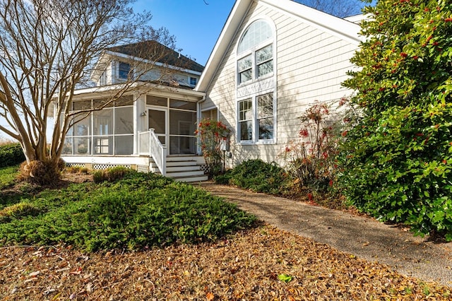 view of front of house with a sunroom