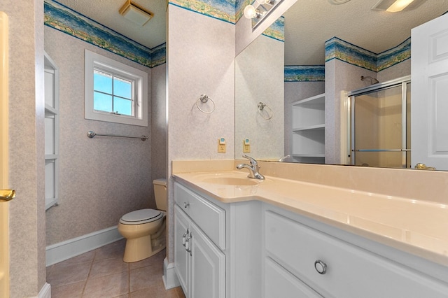 bathroom with tile patterned floors, a textured ceiling, an enclosed shower, toilet, and vanity