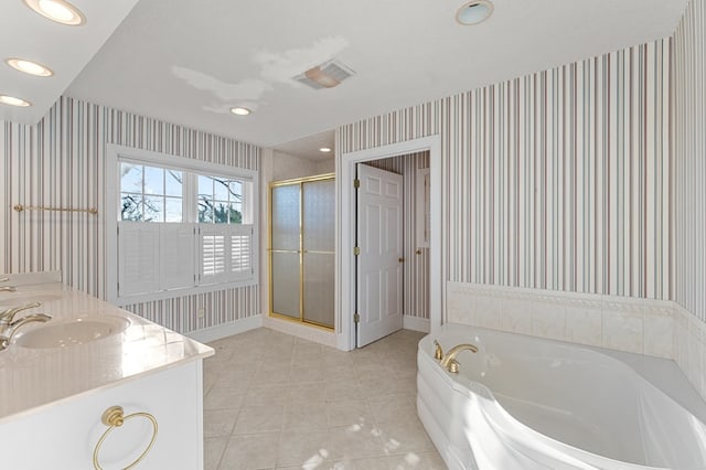 bathroom with separate shower and tub, tile patterned flooring, vanity, and a textured ceiling