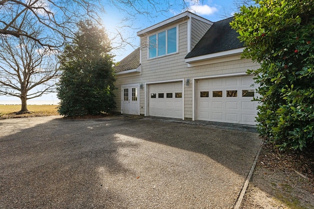 view of side of home with a garage