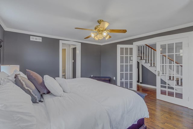 bedroom featuring ceiling fan, french doors, dark wood-type flooring, and ornamental molding