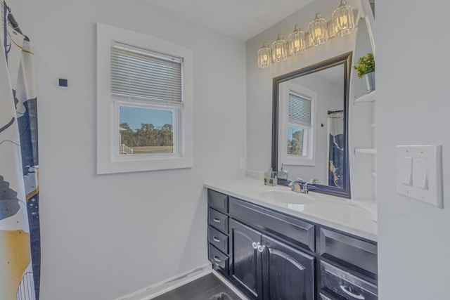 bathroom featuring a wealth of natural light and vanity