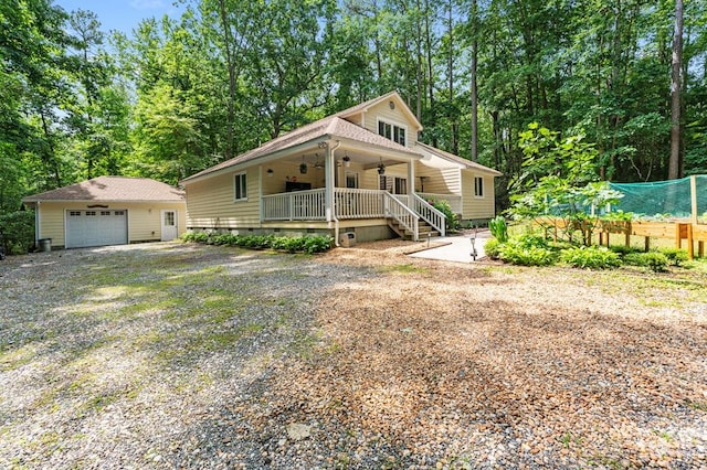 578 Canvasback Ln, Heathsville, VA 22473 - view of front of house with ceiling fan, crawl space, an outdoor structure, a detached garage, and gravel driveway