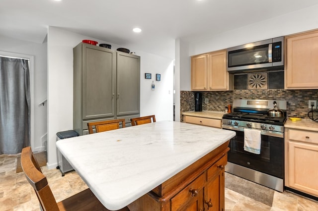 578 Canvasback Ln, Heathsville, VA 22473 - kitchen featuring appliances with stainless steel finishes, tasteful backsplash, light countertops, light brown cabinets, and recessed lighting