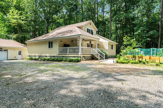 578 Canvasback Ln, Heathsville, VA 22473 - view of front of home with ceiling fan, crawl space, covered porch, a shingled roof, and view of scattered trees