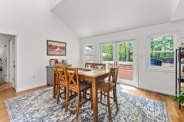 578 Canvasback Ln, Heathsville, VA 22473 - dining room with plenty of natural light, light wood-style flooring, french doors, baseboards, and high vaulted ceiling