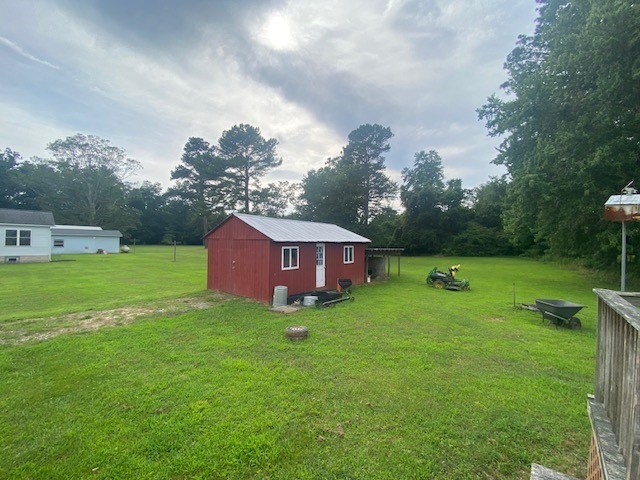 3097 Oakland Rd, Farnham, VA 22460 - view of green lawn with an outbuilding and view of scattered trees