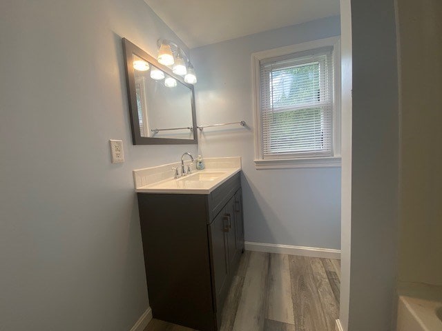 3097 Oakland Rd, Farnham, VA 22460 - bathroom featuring vanity, wood finished floors, and a bathtub