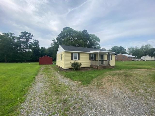 3097 Oakland Rd, Farnham, VA 22460 - manufactured / mobile home with driveway, covered porch, a front yard, and an outdoor structure