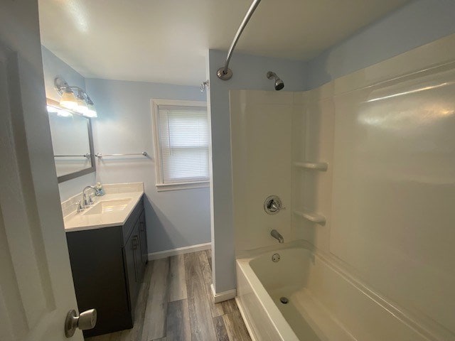 3097 Oakland Rd, Farnham, VA 22460 - bathroom featuring vanity, shower / washtub combination, and wood finished floors