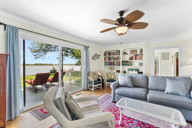 1743 Bushfield Rd, Montross, VA 22520 - living area with a water view, ceiling fan, ornamental molding, and wood finished floors