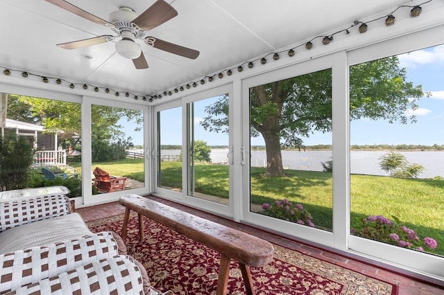 1743 Bushfield Rd, Montross, VA 22520 - sunroom with a water view, brick floors, a ceiling fan, and healthy amount of natural light