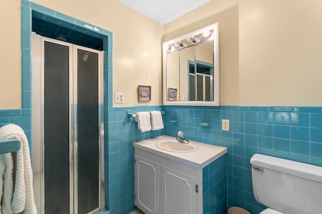 1743 Bushfield Rd, Montross, VA 22520 - bathroom with tile walls, vanity, a wainscoted wall, and a shower stall