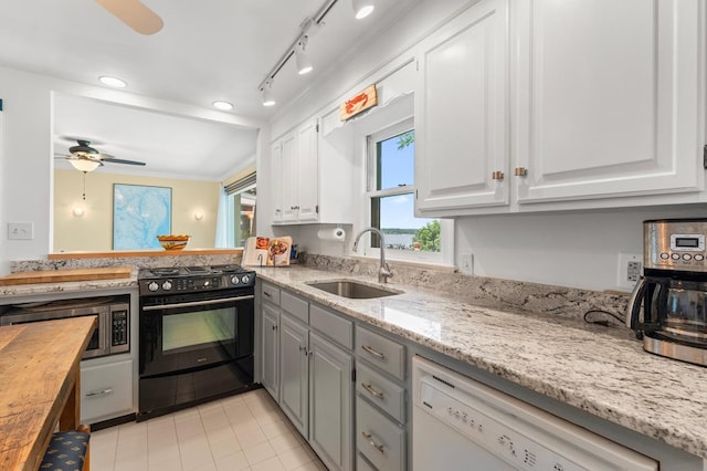 1743 Bushfield Rd, Montross, VA 22520 - kitchen with gas stove, dishwasher, ceiling fan, stainless steel microwave, and white cabinets