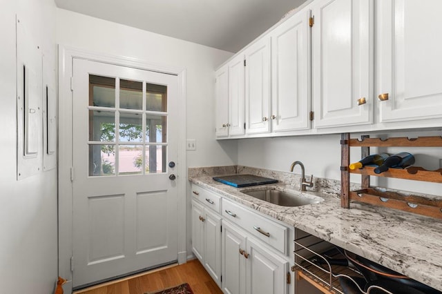1743 Bushfield Rd, Montross, VA 22520 - laundry area with a sink and light wood finished floors