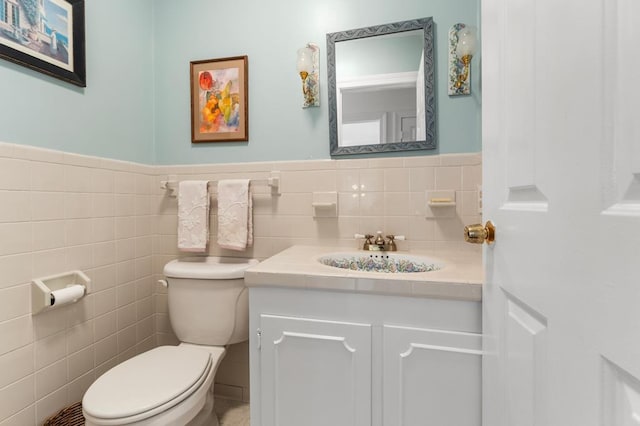 1743 Bushfield Rd, Montross, VA 22520 - bathroom with vanity, tile walls, and a wainscoted wall