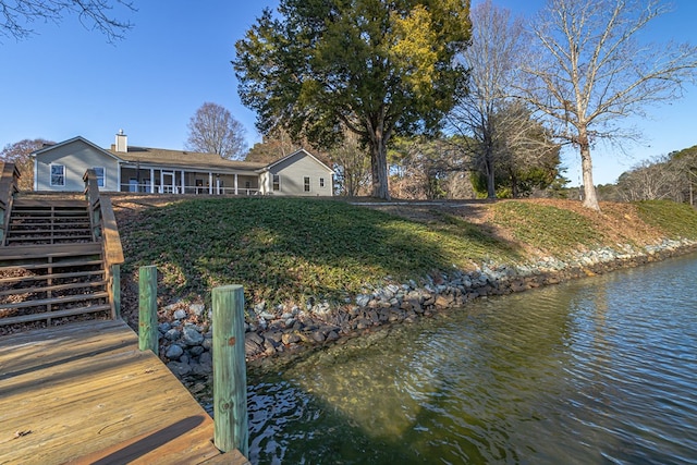 dock area with a water view