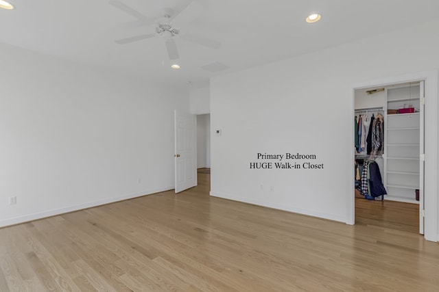 unfurnished bedroom with ceiling fan, a closet, and light hardwood / wood-style floors