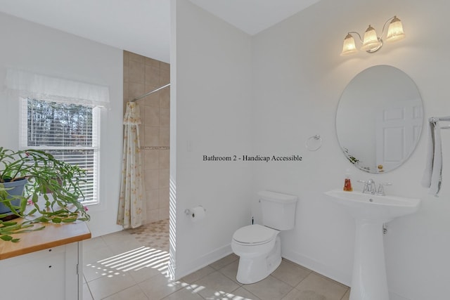 bathroom featuring tile patterned flooring, a shower with shower curtain, and a wealth of natural light