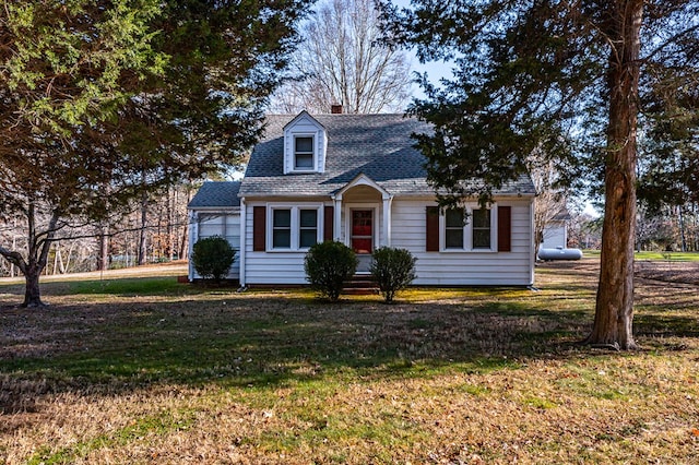 new england style home with a front yard