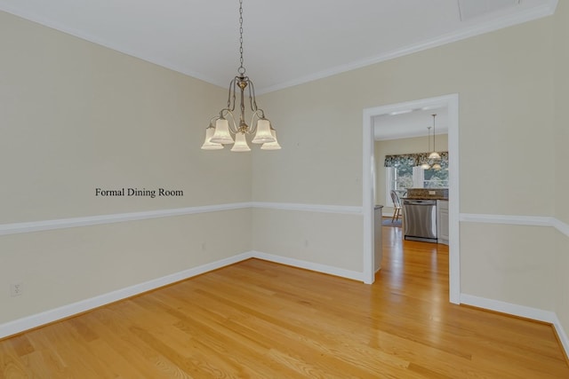 unfurnished room with a chandelier and hardwood / wood-style flooring