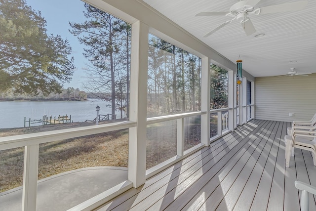 wooden deck featuring ceiling fan and a water view